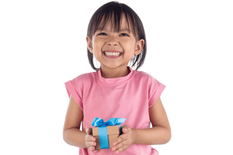 girl's hands holding a gift box isolated on white background with clipping path
