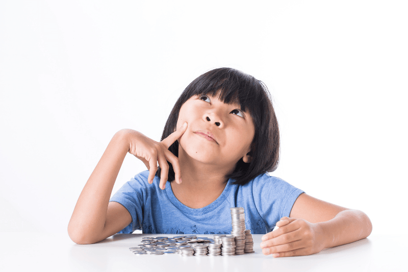 girl and pile coin for saving. money concept in thinking action with white background