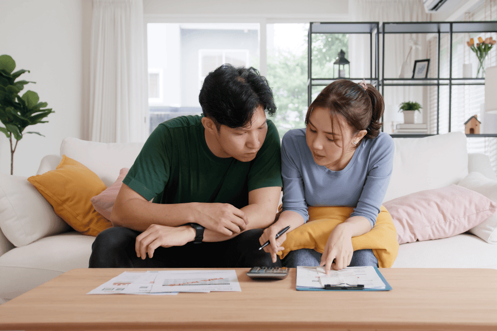 Rising high cost of living in low poor income asia people family. Past due bill debt home loan money issue young adult asian couple man woman worry shock sad tired stress in raise tax rate crisis