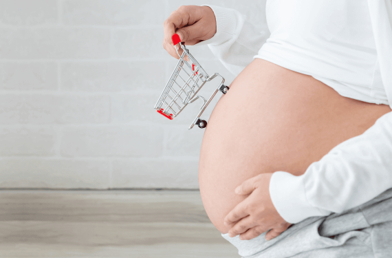 Pregnant women buy baby products and holding shopping cart, Pregnancy shopping item for children concept