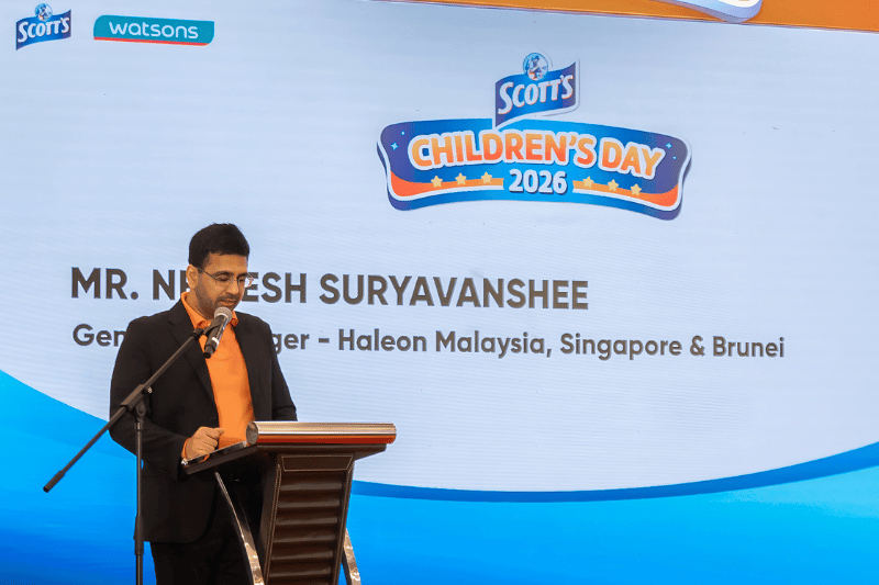 male giving speech on stage on a podium for roadshow launch