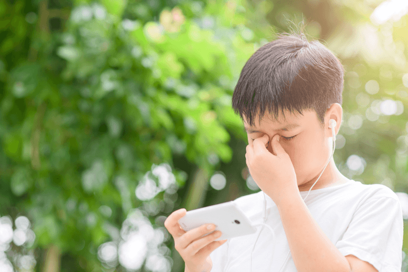 boy eye strain due to excessive screen time