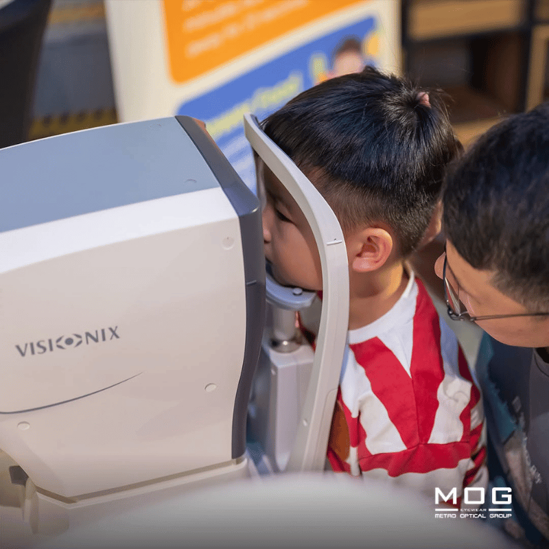 boy getting his eye checked for glasses myopia check
