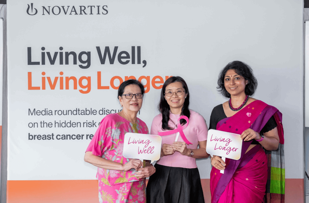 breast cancer awarness round table three women taking group photo after a media session promoting breast cancer awarness