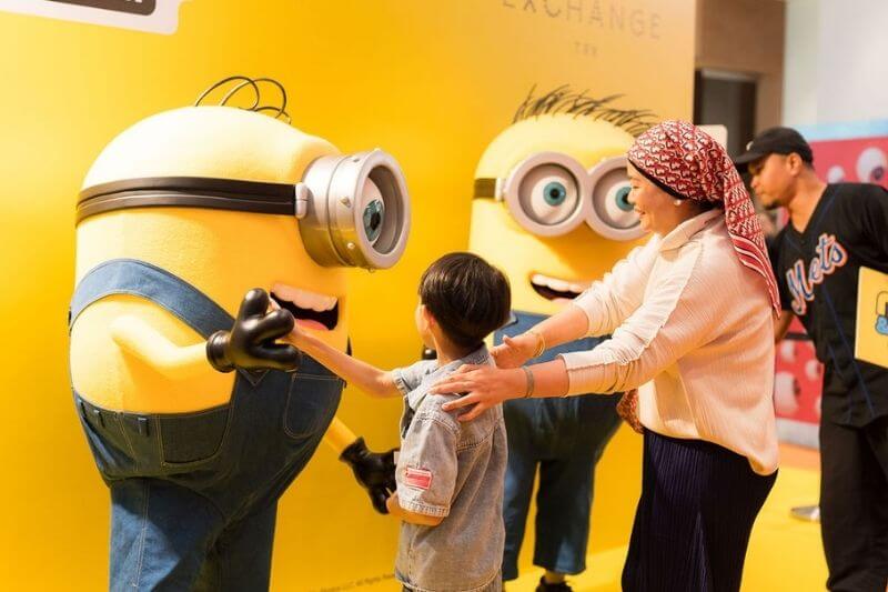 minion trx mall visitors taking photo with minion in costume