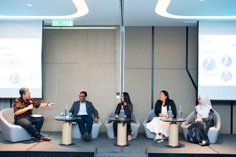 panel discussion on stage malaysian men and women