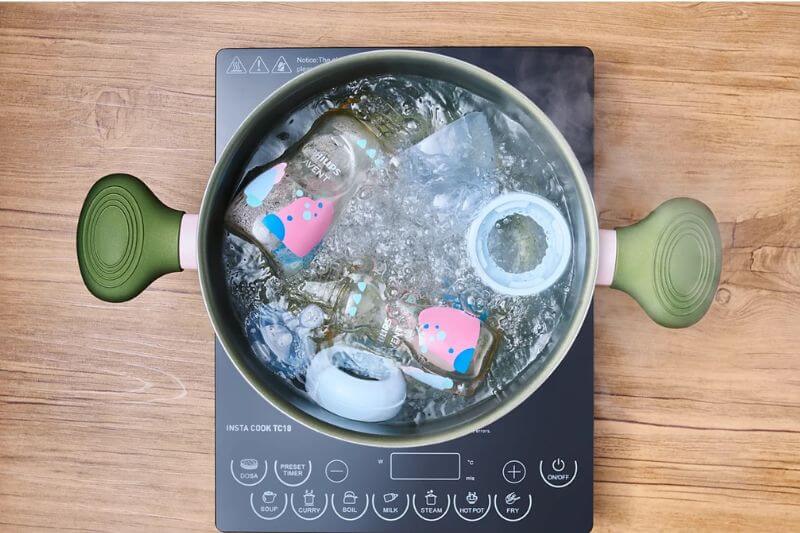 feeding bottle sterilising hot water boiling water