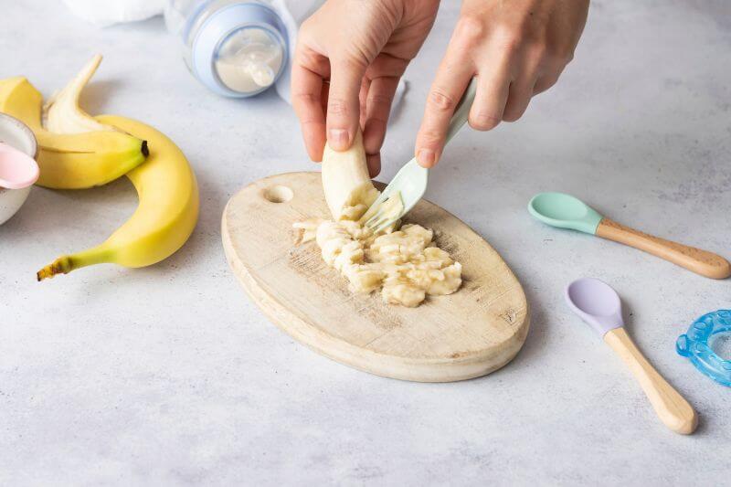 mashing banana for baby food