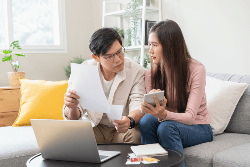 Parent planning family healthcare budget in Malaysia