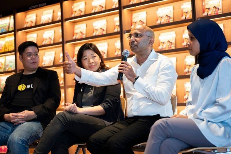 guest speaking with mic on stage