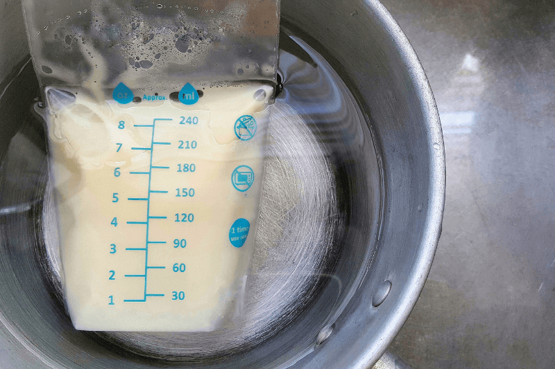 thawing breast milk in warm water