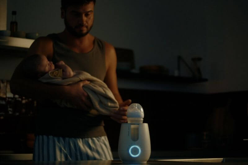 father during night feeds warming up milk with philips avent bottle warmer