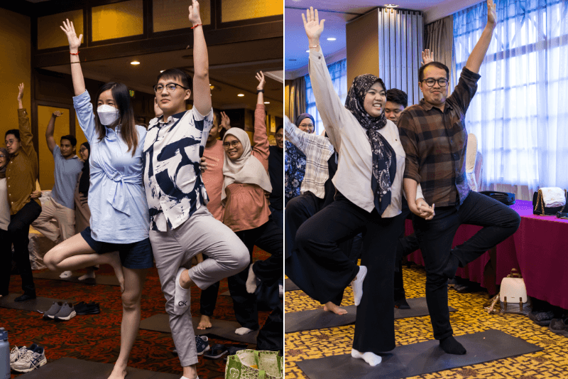 Participants doing tree pose yoga at Bukit Kiara Equestrian and Resort wellness expo