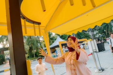 lady playing at family bazaar