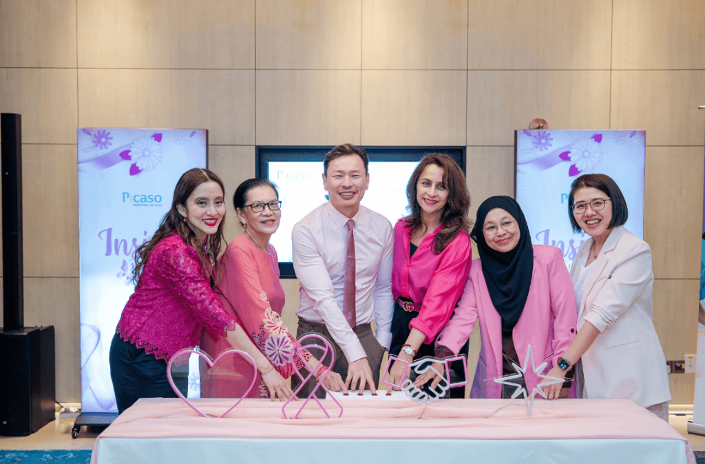 Specialists at the light box moment during “Inside Her Story”, representing courage, awareness, support and hope in the breast cancer journey.