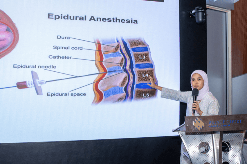 A Prince Court Medical Centre speaker explains an epidural diagram during the Parentcraft Workshop.