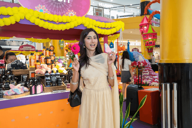 Visitor exploring a festive activity and shopping booth at Sunway Pyramid's Deepavali 2026 celebration