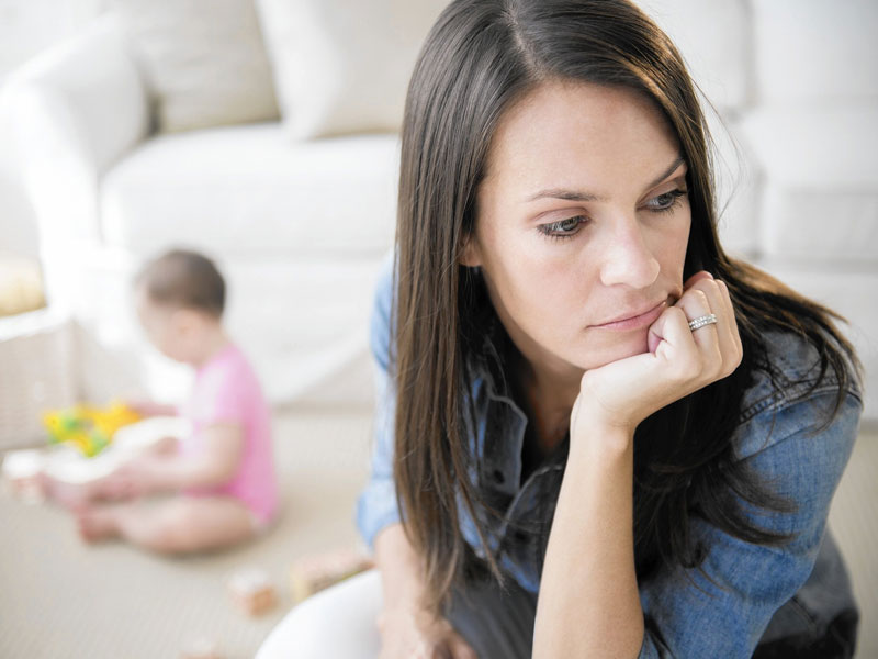 Woman stressed while babysitting