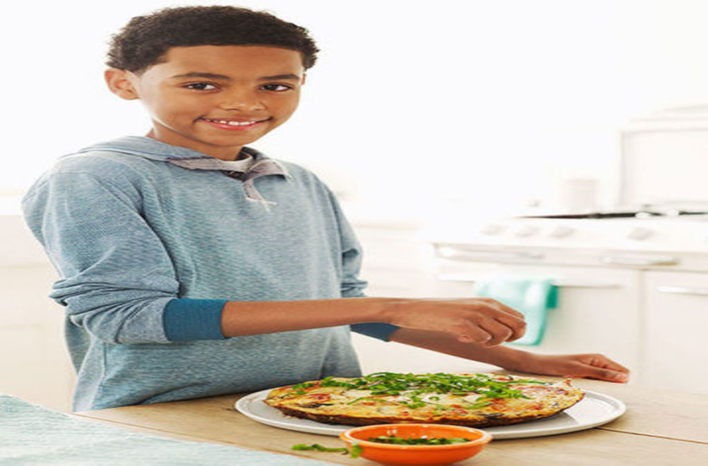 boy with a plate of pizza