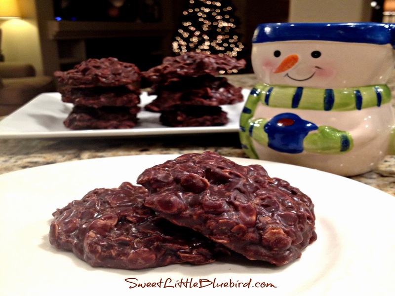stacks on chocolate cookies on plates with santa cup