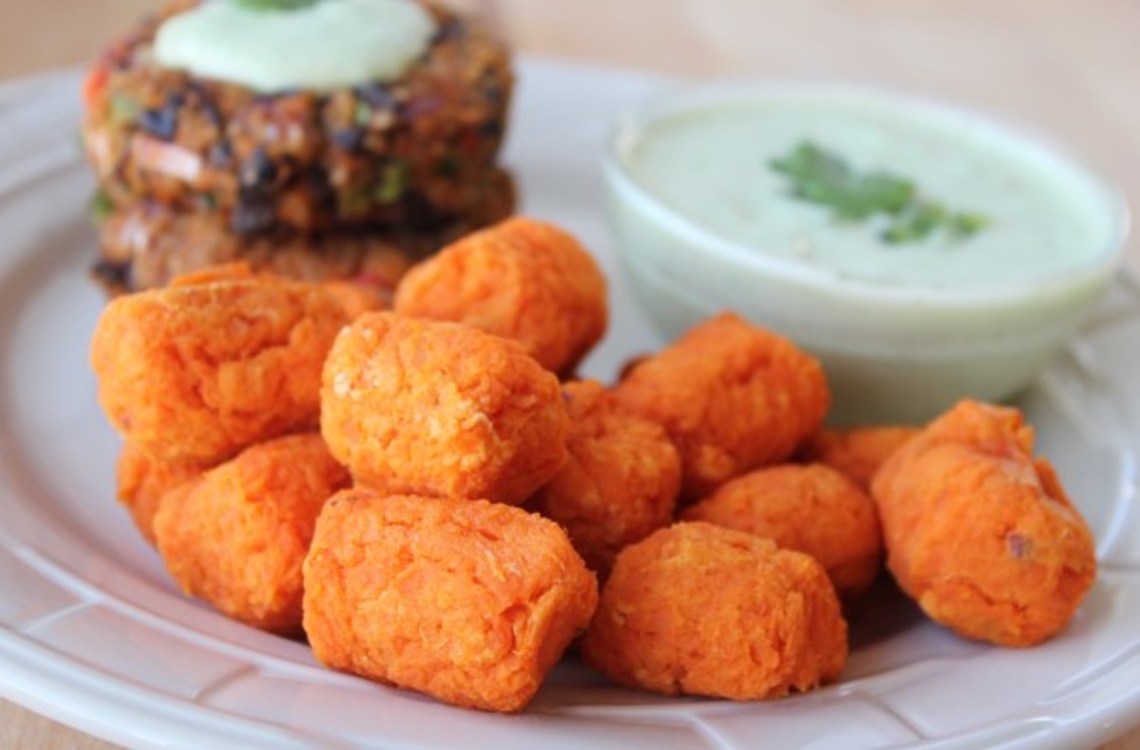 sweet potato tots with dipping sauce on the side