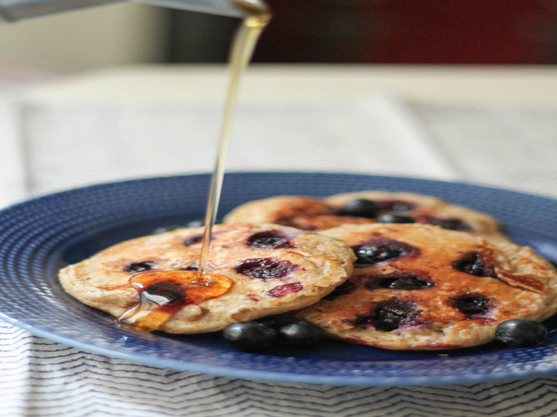 blueberry pancakes drizzled with honey